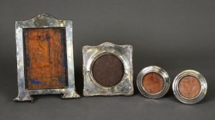 FOUR EDWARD VII AND LATER SILVER FRONTED DESK OR DRESSING TABLE TOP PHOTOGRAPH FRAMES, including a