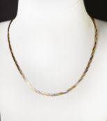 9ct GOLD THREE-COLOURED GOLD FLAT THREE STRAND NECKLACE, 16in (41cm) long, 2.8gms and a