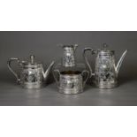 VICTORIAN EMBOSSED SILVER FOUR PIECE TEA AND COFFEE SET BY MARTIN, HALL & Co, of tapering form