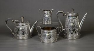 VICTORIAN EMBOSSED SILVER FOUR PIECE TEA AND COFFEE SET BY MARTIN, HALL & Co, of tapering form
