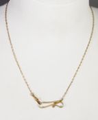 LADY'S VICTORIAN GOLD COLOURED METAL ALBERTINA, the fine chain having a watch clip at one end and