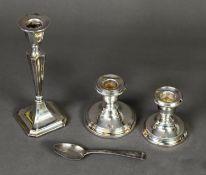 TWO GEORGE V WEIGHTED SILVER CANDLE HOLDERS, of typical form, Birmingham 1924 and 1928, 3” (7.6cm)