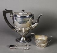 LATE VICTORIAN SILVER OVAL PEDESTAL COFFEE POT, crested and demi gadrooned, with blackwood handle