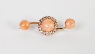 VICTORIAN GOLD COLOURED METAL BROOCH, with S scroll shaped bar centred by a circula pale pink