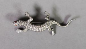 SILVER AND PASTE SET LIZARD BROOCH, with red eyes, 2 3/8in (6cm) long