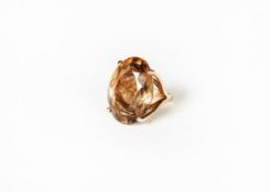 GOLD COLOURED METAL DRESS RING, with a large oval citrine in a four claw setting, ring size I/J,