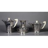 GEORGE VI PLANISHED SILVER AND IVORY FOUR PIECE TEA SET BY ROBERT EDGAR STONE, of flared form with