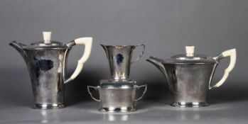 GEORGE VI PLANISHED SILVER AND IVORY FOUR PIECE TEA SET BY ROBERT EDGAR STONE, of flared form with