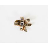 VICTORIAN GOLD COLOURED METAL BOW BROOCH, the centre set with square sapphire and surround of twelve