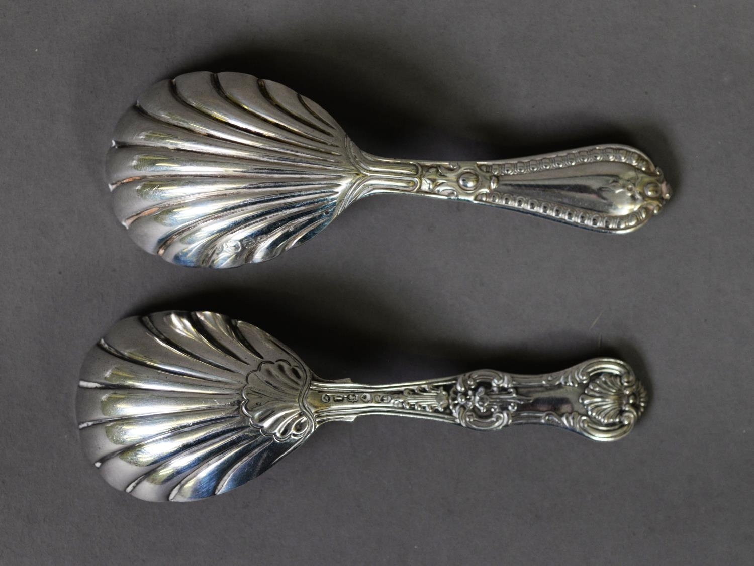 TWO VICTORIAN SLIVER CADDY SPOONS WITH SHELL PATTERN BOWLS AND FANCY HANDLES, comprising, a Queens - Image 2 of 2