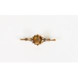 9ct GOLD WING SHAPED OPENWORK BROOCH, set with a hexagonal citrine, 2in (5cm) wide, 5.4gms