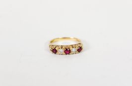 18cgt GOLD DIAMOND AND RUBY RING, with two small round brilliant cut diamonds between three small