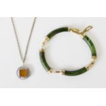 A.J., DENMARK SMALL CIRCUAR SILVER PENDANT set with tiger's eye stone and the CHAIN NECKLACE and a