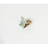 GOLD COLOURED METAL DRESS RING, set with a large oblong pale blue stone in a four claw setting, ring