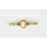 EARLY 20th CENTURY GOLD COLOURED METAL OPENWORK BROOCH, collet set with an oval shell cameo carved