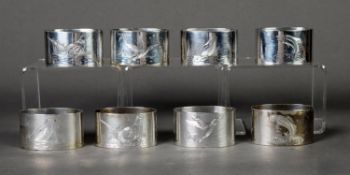 SET OF EIGHT ENGRAVED SILVER NAPKIN RINGS, each of oval form, decorated in pairs, with game birds or