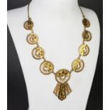 GOLD COLOURED METAL CHAIN NECKLACE, the front with nine graduated cricular links, each half panel