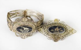 MIDDLE EASTERN FILIGREE SILVER AND NIELO WORK BRACELET with three pictorial panels and a silver