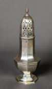 EDWARD VII SILVER PEDESTAL SUGAR CASTOR, of panelled form with pull-off and pierced cover, 6 ½” (