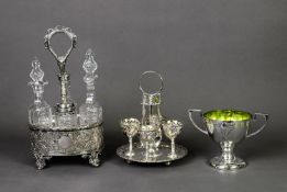 ELECTROPLATED EGG CRUET SET FOR FOUR PERSONS, with cups and spoons to the circular, pierced stand,
