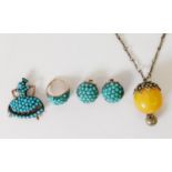SUITE OF TURQUOISE BEAD SET JEWELLERY, viz a ring, a pair of clip earrings and a female figure