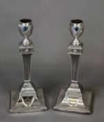 PAIR OF VICTORIAN WEIGHTED SILVER TABLE CANDLESTICKS IN THE NEO CLASSICAL STYLE, each with urn