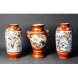 THREE JAPANESE KUTANI PORCELAIN VASES, one of two handled baluster form with bird mask capped