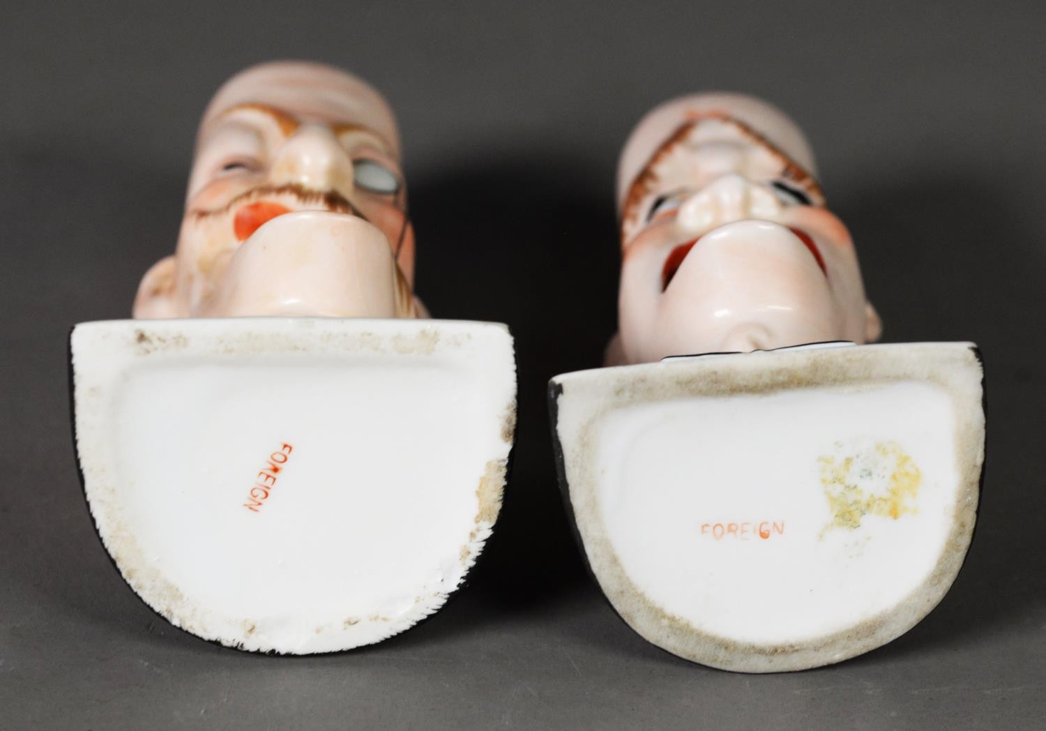 A PAIR OF PORCELAIN SMOKING HEAD ASHTRAYS, by Schafer & Vater; 'For he's a jolly good fellow' and ' - Image 2 of 2