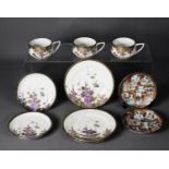 THREE MATCHING ORIENTAL PORCELAIN TEA CUP, SAUCER AND SIDE PLATE SETS, each decorated in colours and