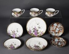 THREE MATCHING ORIENTAL PORCELAIN TEA CUP, SAUCER AND SIDE PLATE SETS, each decorated in colours and