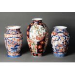 THREE JAPANESE MEIJI PERION IMARI PORCELAIN VASES, one of ovoid form, decorated with panels