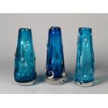 THREE WHITEFRIARS KNOBBLY GLASS VASES IN BLUE, of slightly tapering form, one slightly darker in
