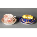 NINETEENTH CENTURY MINTON CABINET CHINA TEA CUP AND SAUCER, red printed with Oriental scroll work,