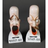 A PAIR OF PORCELAIN SMOKING HEAD ASHTRAYS, by Schafer & Vater; 'For he's a jolly good fellow' and '