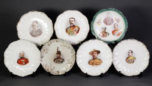 SEVEN NINETEENTH CENTURY POTTERY PORTRAIT PLATES, each with gilt lined and moulded border and colour