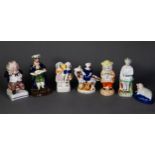 FIVE NINETEENTH CENTURY STAFFORDSHIRE POTTERY SMALL FIGURES OR GROUPS, comprising: SUGAR CASTOR,