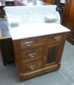AN ART DECO CONTINENTAL ASH MARBLE TOP WASHSTAND, HAVING ONE LONG ABOVE TWO SHORT DRAWERS AND