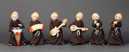 SET OF SIX ‘FOREIGN’ PORCELAIN MONKS BAND, each modelled with instrument, 5 ¼” (13.3cm) high,