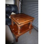 AN INDONESIAN DARK WOOD RECTANGULAR COFFEE TABLE WITH METAL STUDS AND CORNERS AND A MATCHING