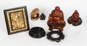 SMALL GROUP OF CHINA RELATED CARVINGS, including vase stands, carved wood Buddhas, a soapstone
