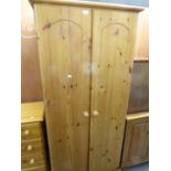 A MODERN WAXED PINE SMALL TWO DOOR WARDROBE, A MATCHING 4 DRAWER CHEST AND A DOUBLE HEADBOARD (3)