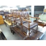 A SET OF FOUR GOTHIC OAK CARVER CHAIRS WITH STUFF-OVER SEATS