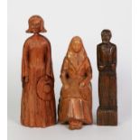 VINTAGE CARVED WOOD FIGURE OF A NUN, seated on a rustic chair, 8 1/2in (21.5cm) high; a vintage