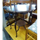 A LARGE MAHOGANY OCCASIONAL TABLE WITH SHAPED TOP AND RAISED ON SIX SCROLL LEGS ATTACHED TO UNDER-