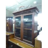 A SMALL SUPERSTRUCTURE MAHOGANY BOOKCASE, HAVING TWO GLAZED DOORS AND ADJUSTABLE SHELVES 107cm