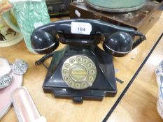 A VINTAGE BLACK BAKELITE ROTARY DIAL TELEPHONE RECEIVER