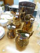 GRADUATED PAIR OF LATE VICTORIAN COPPER LUSTRE EARTHENWARE JUGS, moulded design of ballet dancers,