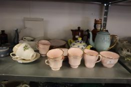 A 25 PIECE PINK VALE POTTERY TEA SET, A MODERN MANX ISLE OF MAN TEAPOT, A NORWEGIAN AND LOVATTS