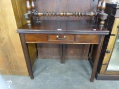 A MAHOGANY FOLD-OVER CARD TABLE, HAVING SINGLE SMALL DRAWER AND RAISED ON FOUR SQUARE TAPERING