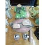 TWO ENAMELLED LADY'S DRESSING TABLE BRUSH SETS, ONE GREEN WITH 6 PIECES, ONE PINK WITH 6 PIECES,